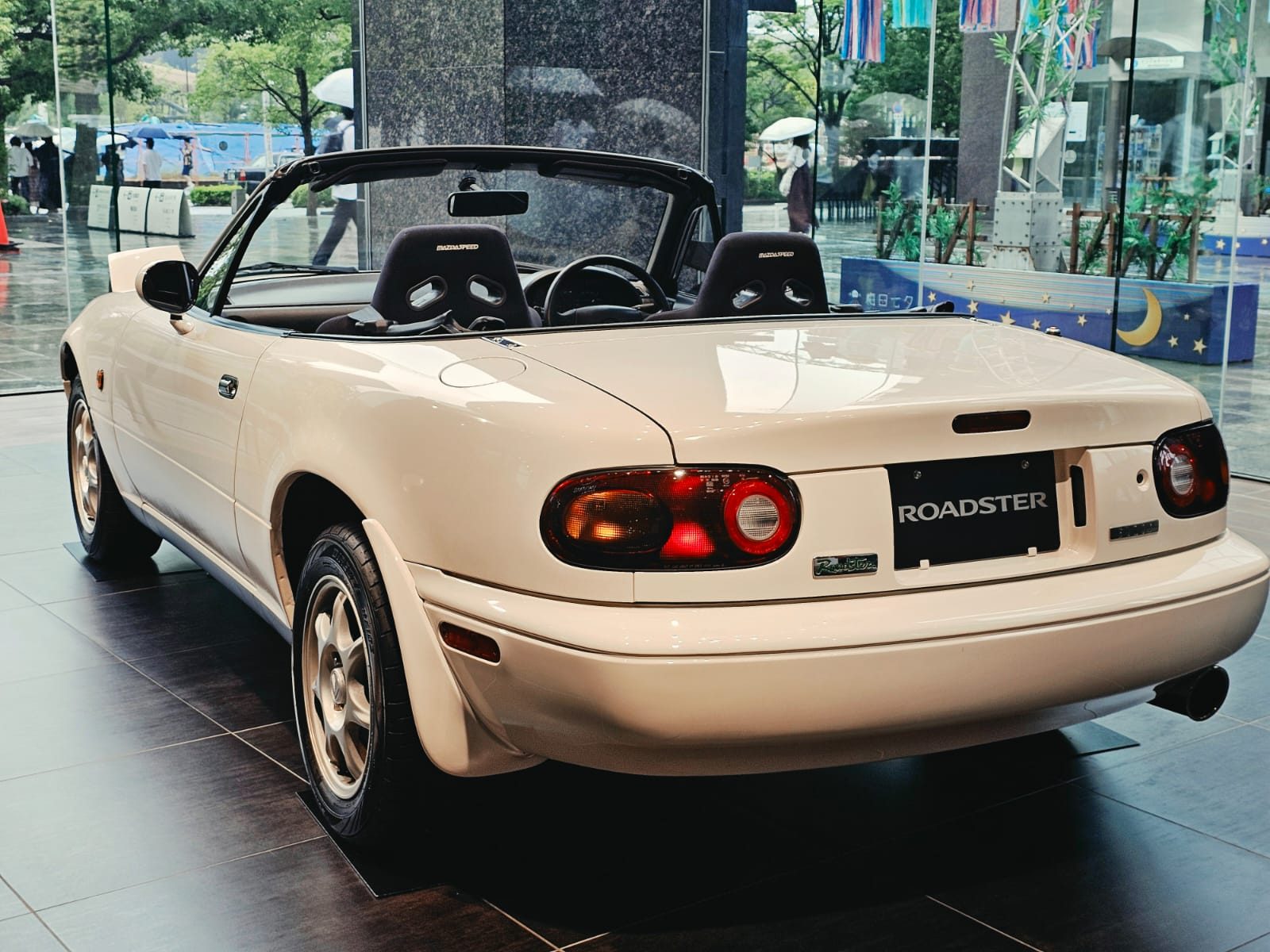 Cream Eunos Roadster on display inside the Mazda Museum
