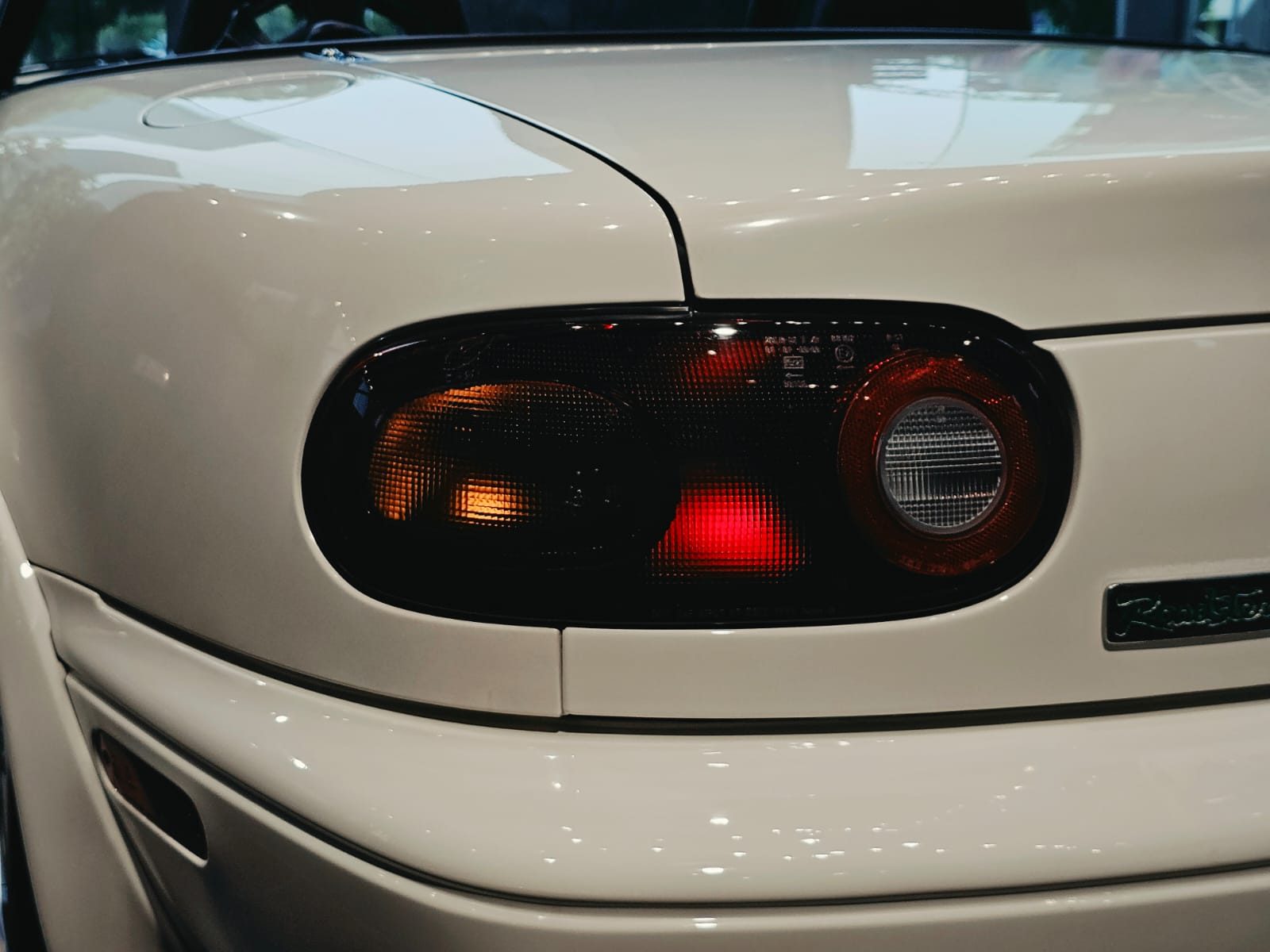 Close-up of the Eunos Roadster's illuminated tail lamp