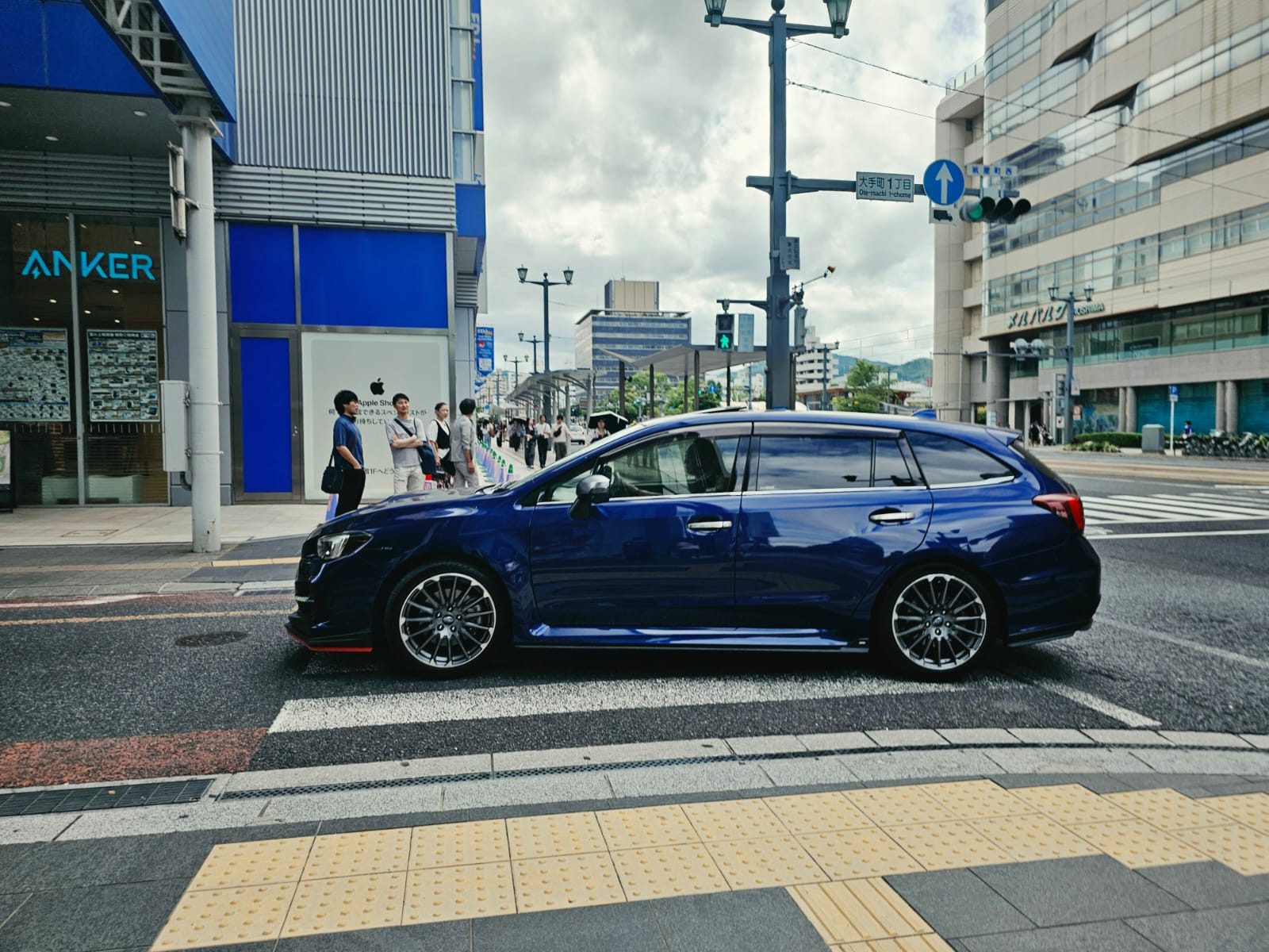 Dark blue Subaru Levorg wagon parked on a city street