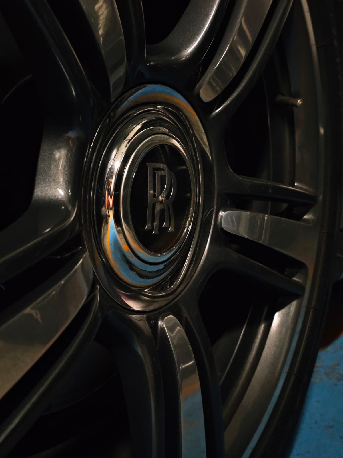 Close-up of a Rolls-Royce wheel center cap