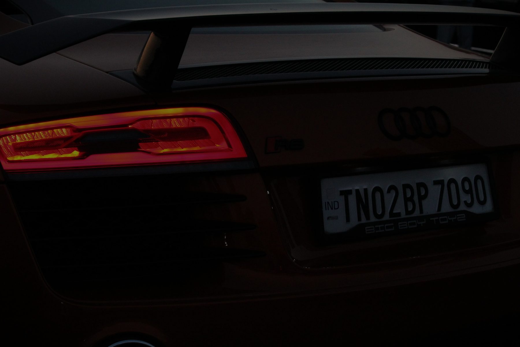 Close-up of the Audi R8's rear badge and license plate reading TN02BP7090