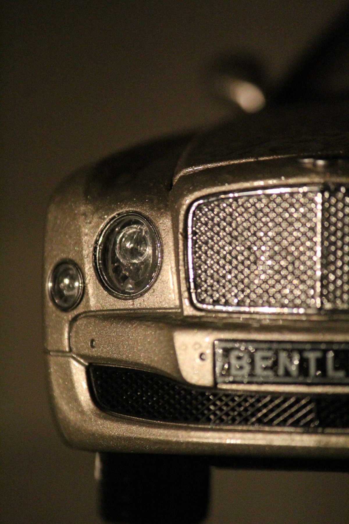 Close-up of a Bentley grille and headlight