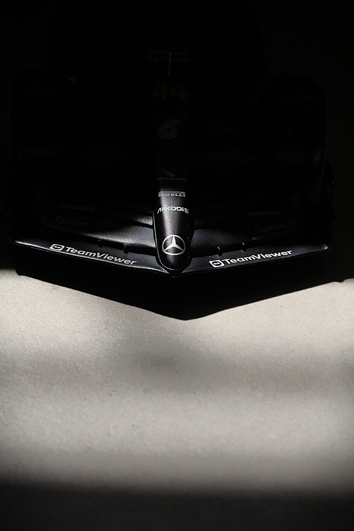 Close-up of a Mercedes Formula 1 car's front wing with sponsor logos
